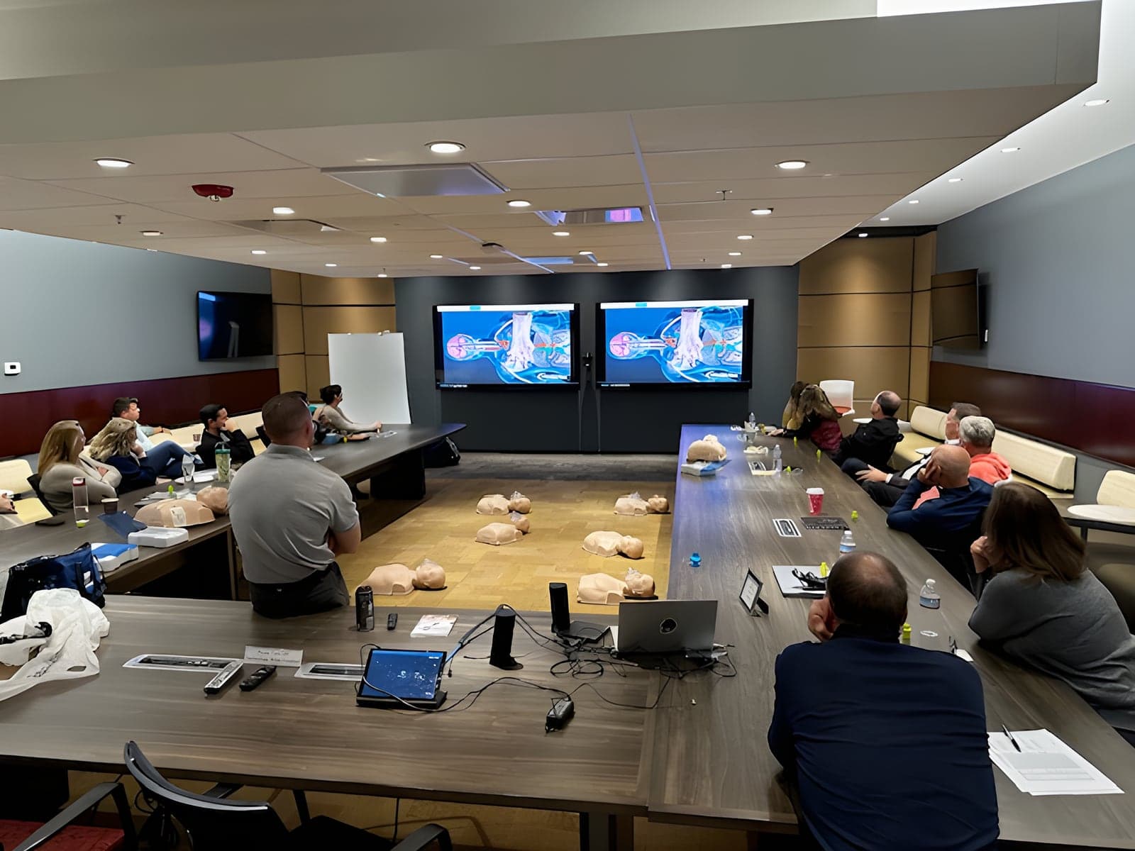 CPR class with manikins in a corporate training room